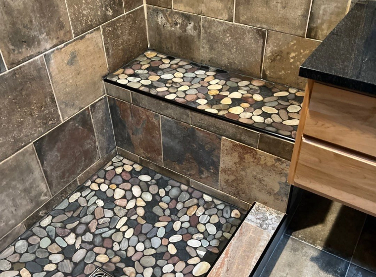 shower bathroom tiled with some brown tiles